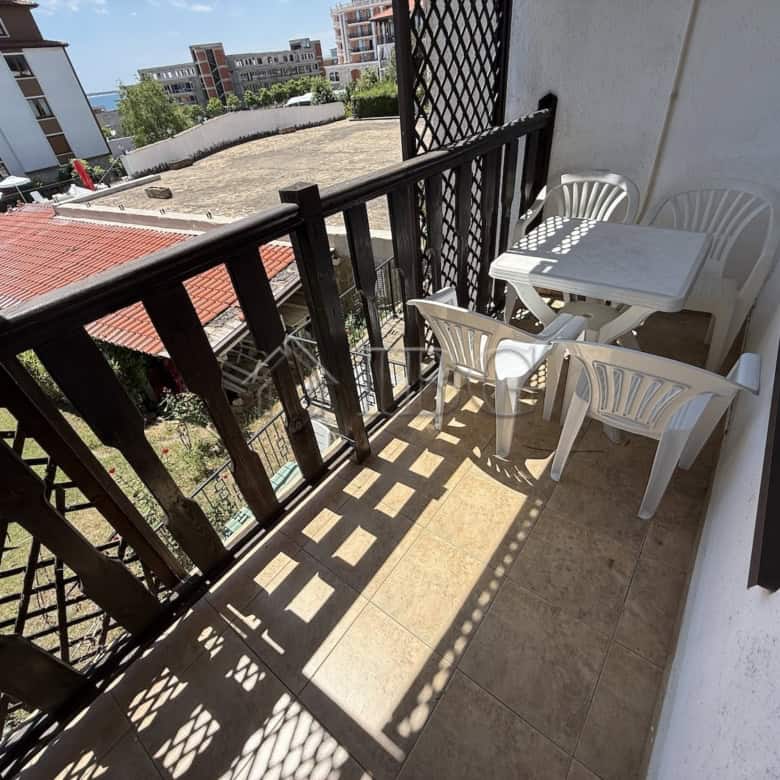 Balcony of a 2-bedroom apartment at Vodenitsata Complex, Sveti Vlas, offering outdoor space and city.