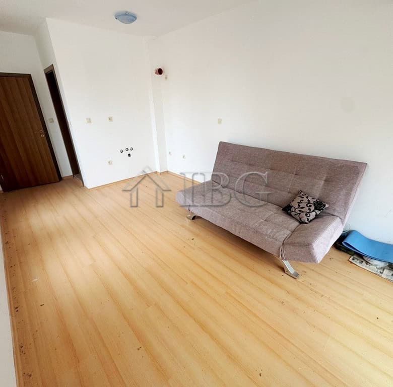 Bright studio apartment with pool view balcony on a sunny day at Sunny Beach.