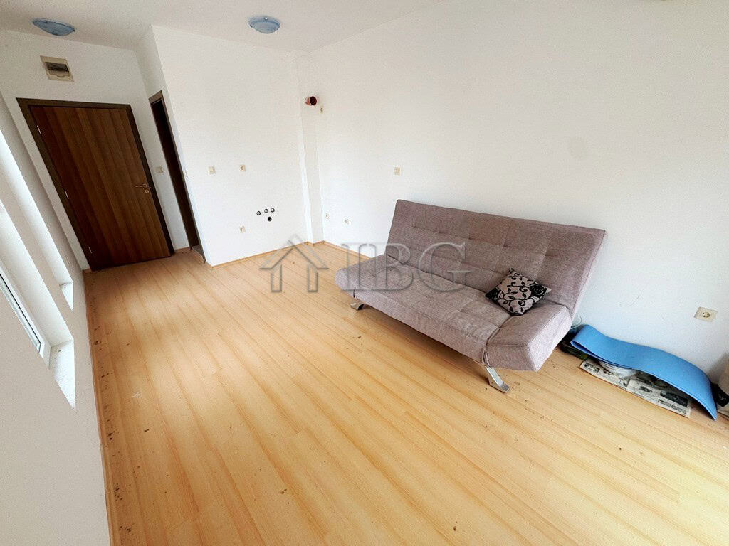 Bright studio apartment with pool view balcony on a sunny day at Sunny Beach.