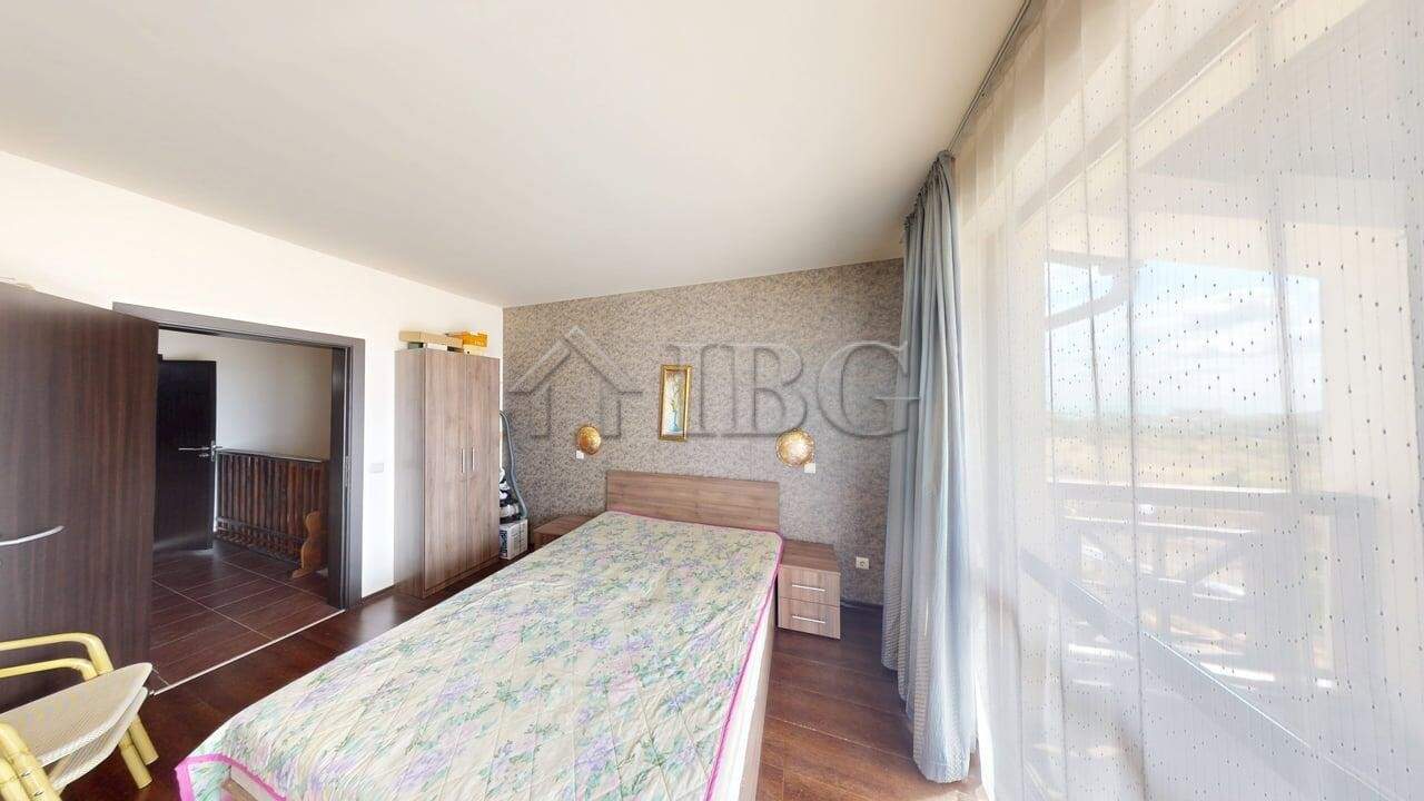 Interior view of a two-story maisonette in Imperial Heights, Kosharitsa, with a spacious bedroom and.