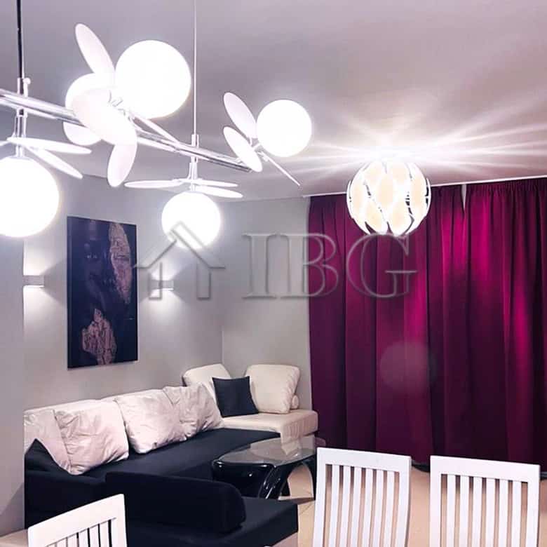 Sea view villa living room with modern decor and stylish lighting.