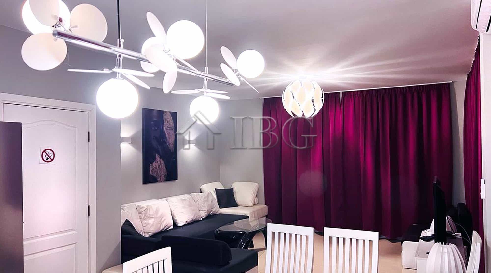 Sea view villa living room with modern decor and stylish lighting.