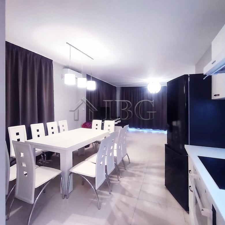 Elegant sea view dining room with modern furniture and ambient lighting.
