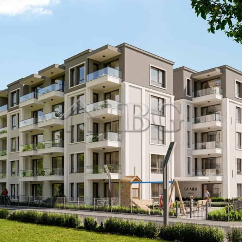 Modern La Mer residential building in Ravda with spacious balconies and lush surroundings.