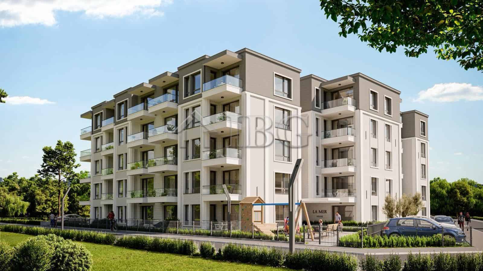 Modern La Mer residential building in Ravda with spacious balconies and lush surroundings.