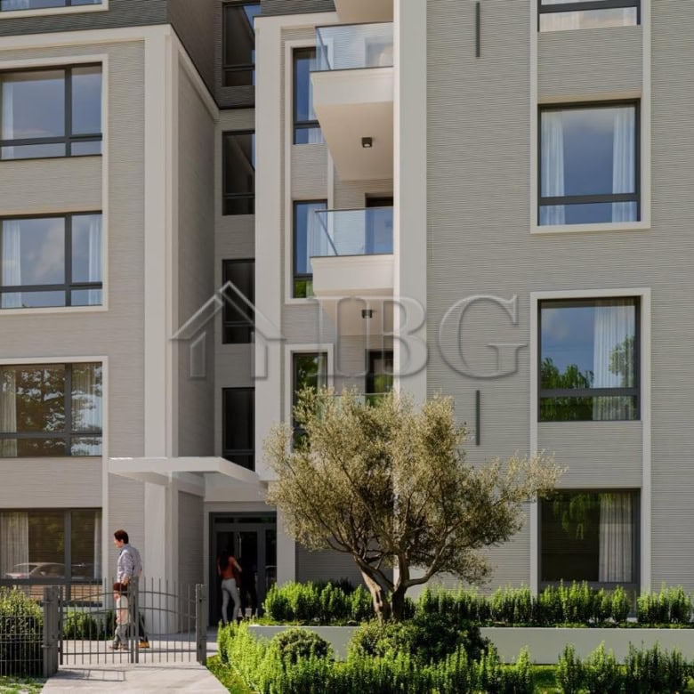 Contemporary apartment building in Ravda with lush landscaping and balconies.