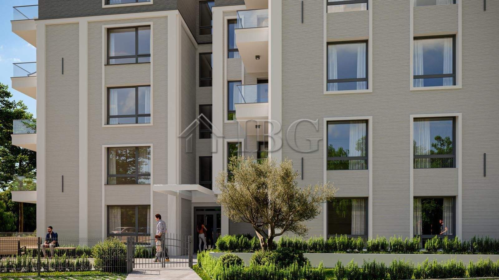 Contemporary apartment building in Ravda with lush landscaping and balconies.
