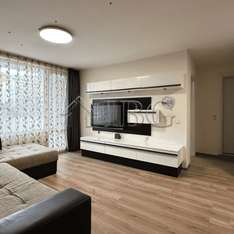 Bright living room with large windows and marina scenery in Sveti Vlas. Modern furnishings and cozy.