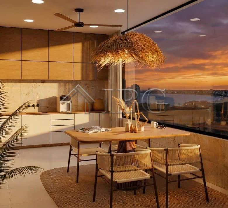 Sea view loggia with modern interiors and sunset scenery.