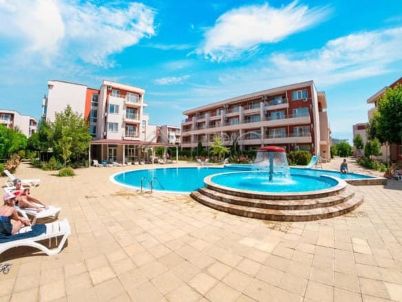 Pool view of a 1-bedroom apartment at Nessebar Fort Club, Sunny Beach, with a large swimming pool an.