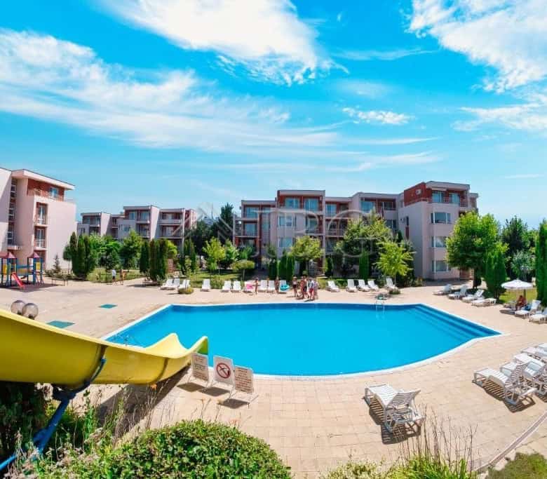 Pool view of a 1-bedroom apartment complex in Sunny Beach, Nessebar Fort Club.