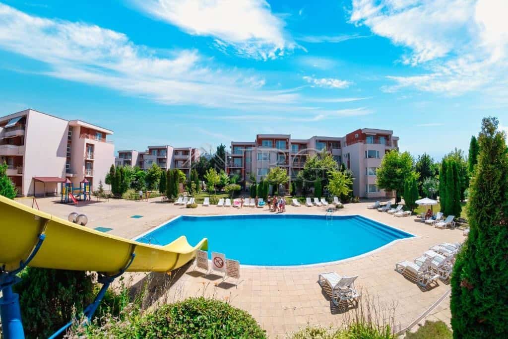 Pool view of a 1-bedroom apartment complex in Sunny Beach, Nessebar Fort Club.