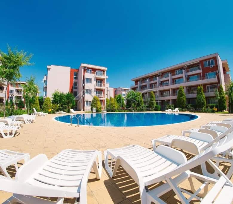 Pool view of a 1-bedroom apartment at Nessebar Fort Club, Sunny Beach, with a large swimming pool an.