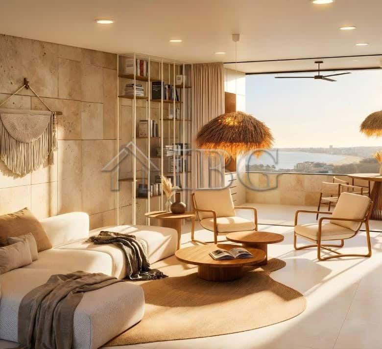 Bright living room with sea view, modern furniture, and natural light in Loggia Residences.