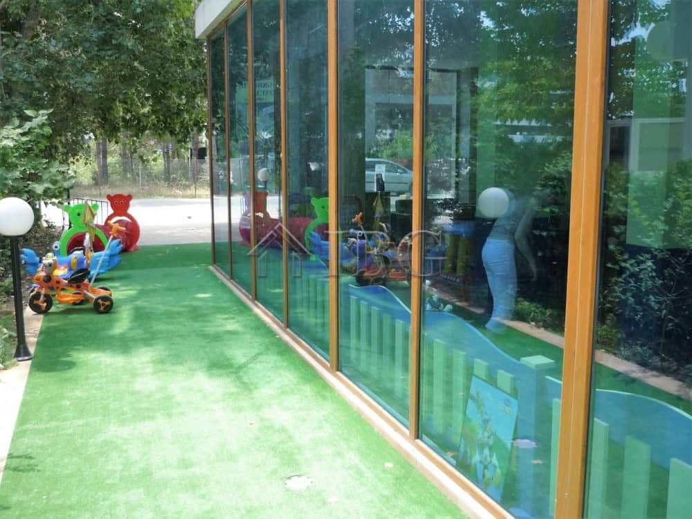 Children's play area outside a sunny development center in Sunny Beach.