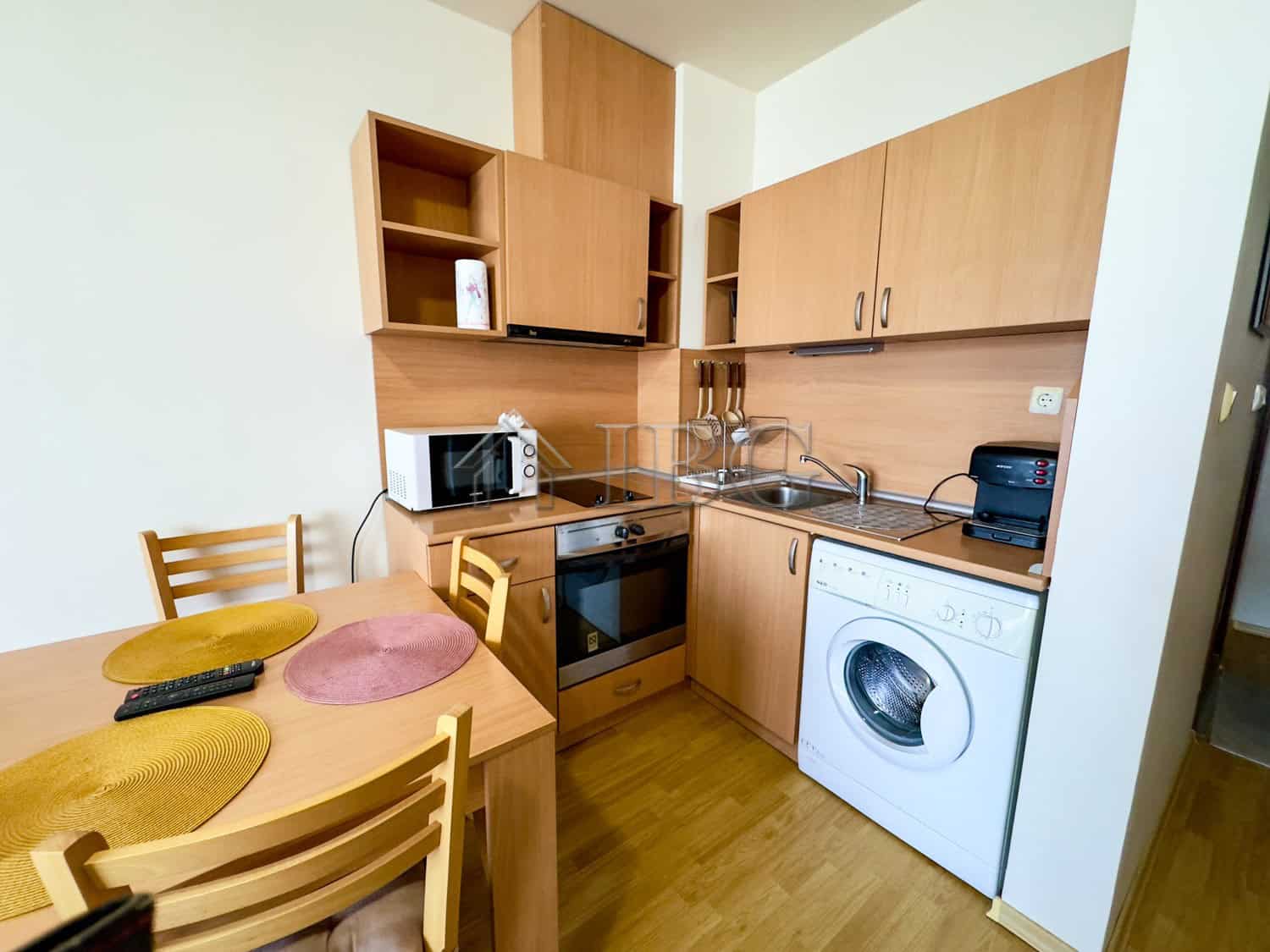 Compact studio apartment for sale in Panorama Bay 1, Sveti Vlas, featuring a functional kitchen and.