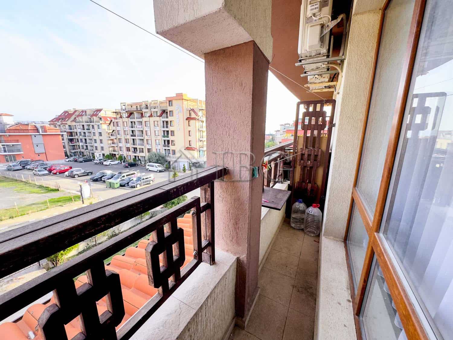 Bright balcony view of Sveti Vlas residential area and surrounding buildings.