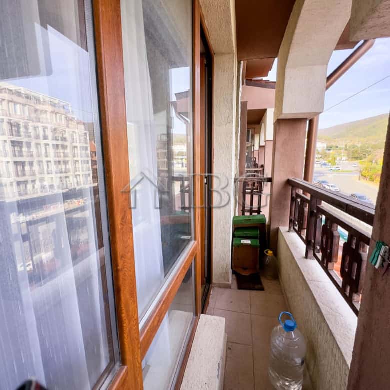 Bright balcony view of Sveti Vlas coastline and mountains.
