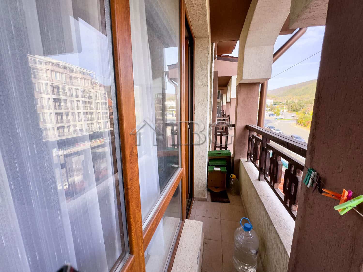 Bright balcony view of Sveti Vlas coastline and mountains.