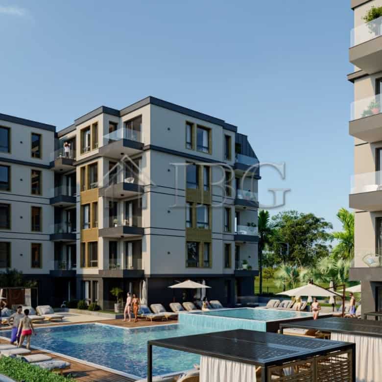 Modern Ravda City Residence apartment complex with pool and outdoor amenities.