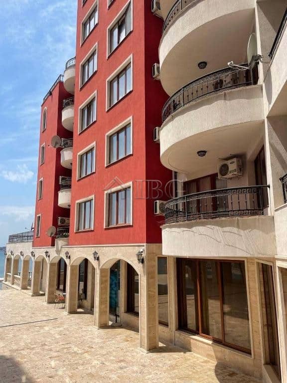 Apartment building with balconies and large windows in Nessebar, Bulgaria.