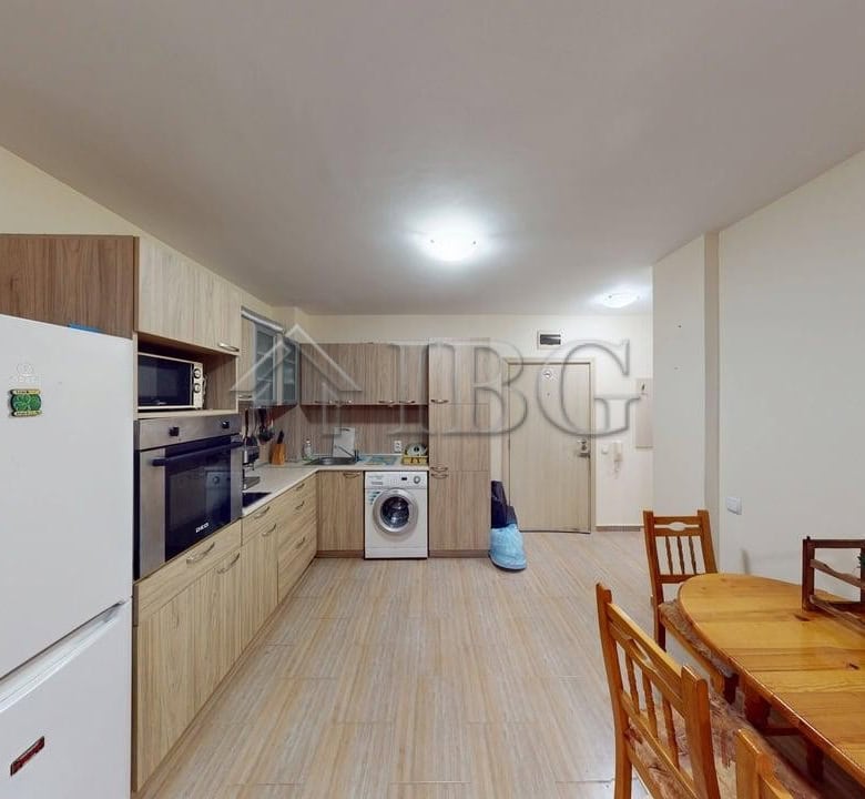 Bright and modern kitchen in a comfortable one-bedroom apartment in Rio.