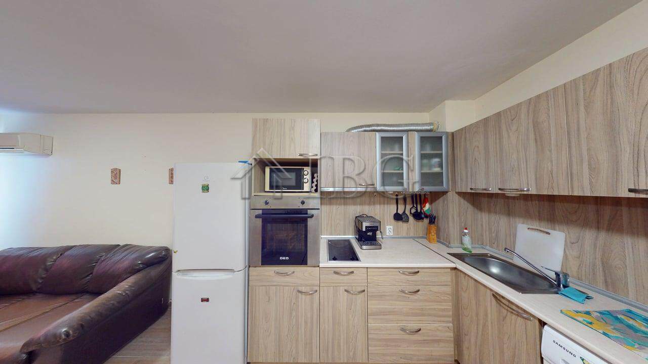Modern kitchen in a comfortable one-bedroom Rio apartment for sale.