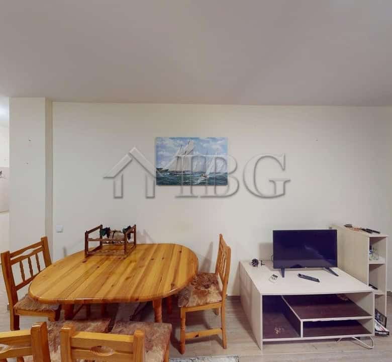 Bright one-bedroom apartment with modern furnishings and a dining area.