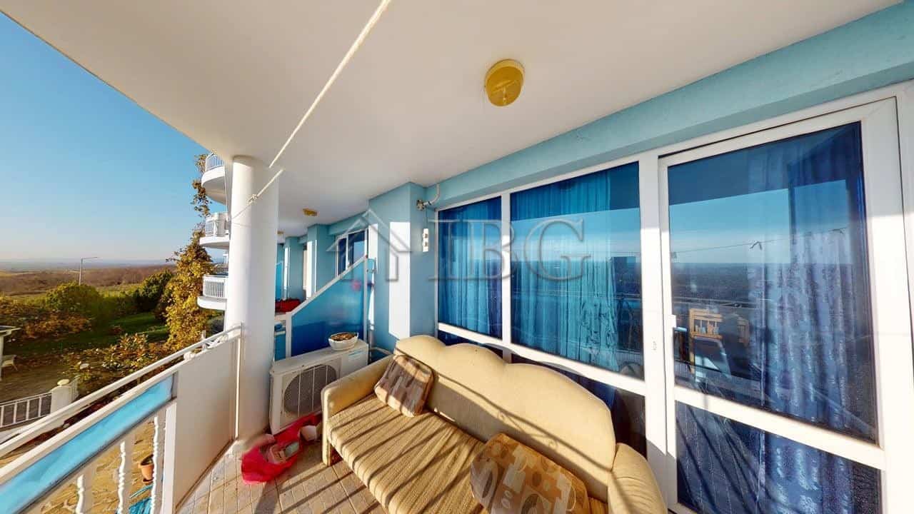 Balcony of modern one-bedroom apartment with sea view in Rio Apartments.
