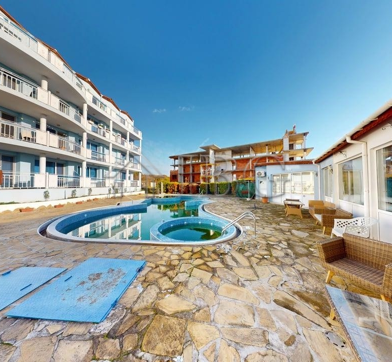 Bright one-bedroom apartment in Rio with a private pool and outdoor seating area. Perfect for relaxi.
