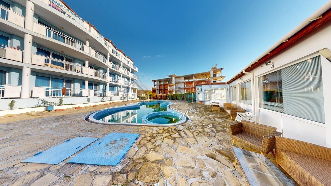 Bright one-bedroom apartment in Rio with a private pool and outdoor seating area. Perfect for relaxi.