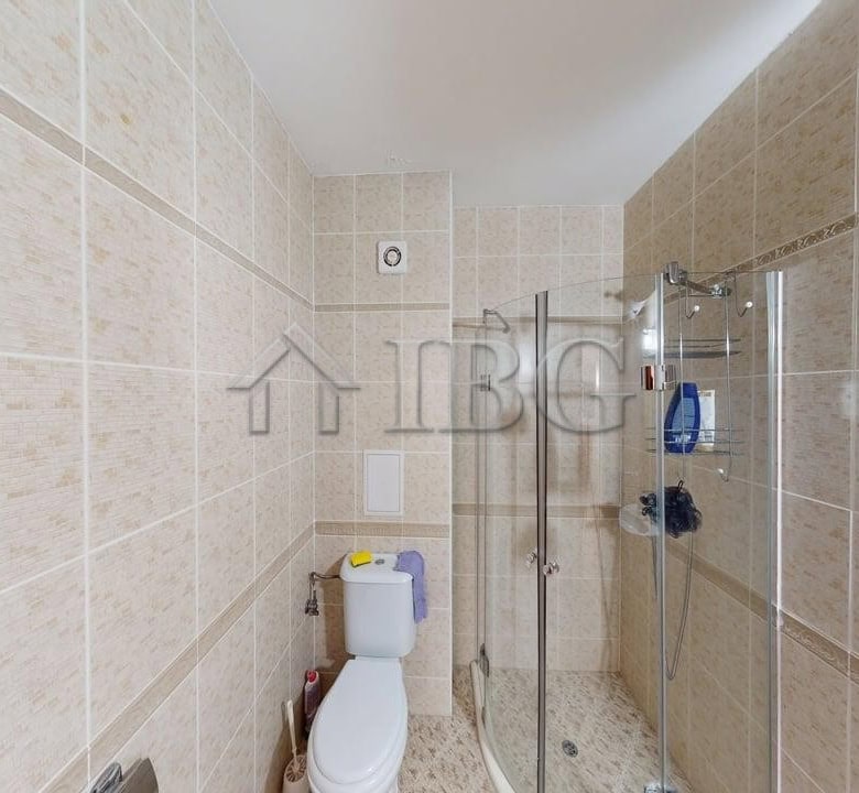 Cozy studio apartment with balcony overlooking lush green yard in Royal Dreams, Sunny Beach.