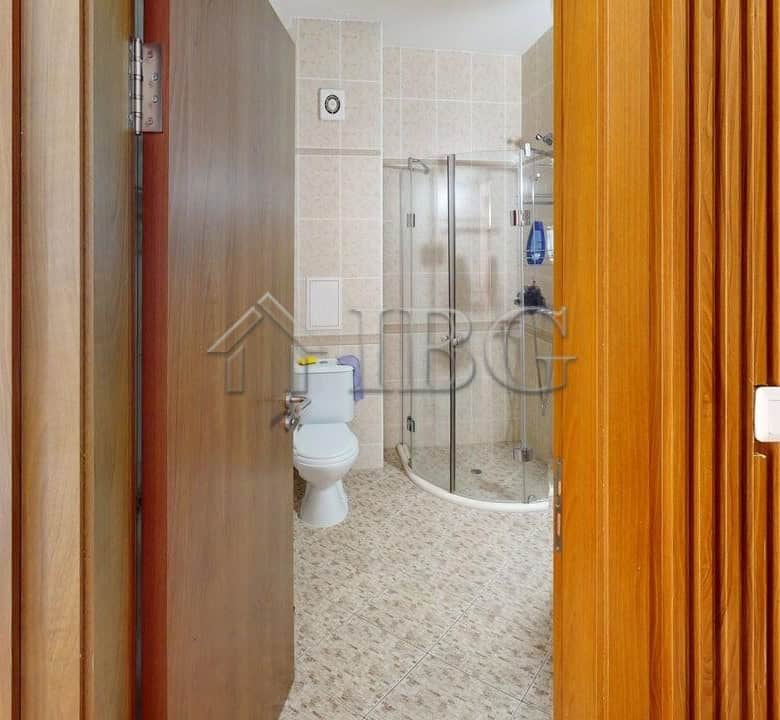 Interior view of a studio apartment with balcony and access to green yard in Royal Dreams, Sunny Bea.