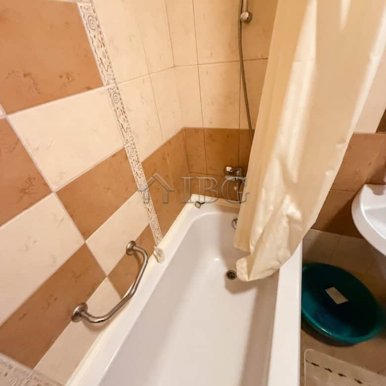 Cozy bathroom with bathtub in a one-bedroom apartment at Royal Sun, Sunny Beach.