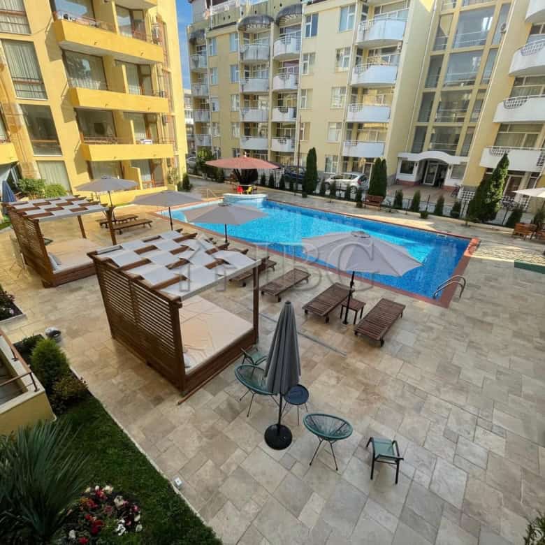 Spacious 2-bedroom apartment with pool, balconies, and outdoor lounge in Sands Complex, Sunny Beach.