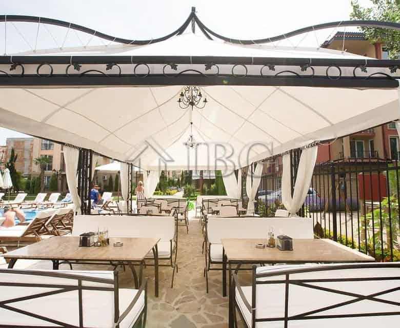 Outdoor lounge with sunbeds and shaded seating at Sunny Beach.