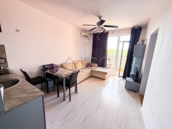 Furnished 2-room apartment for sale with modern decor, bright living space, and balcony views near S.