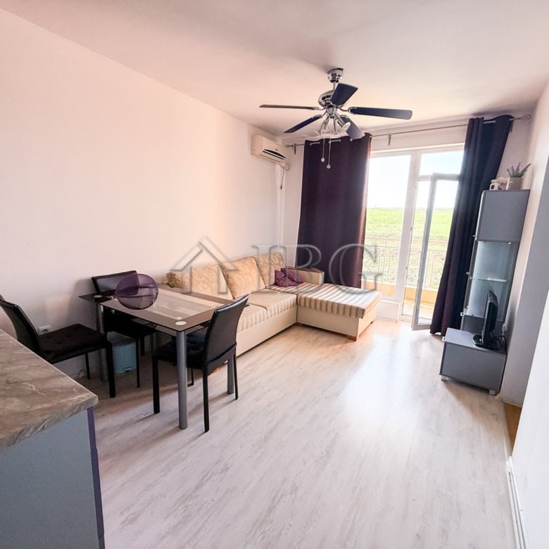 Furnished 2-room apartment for sale with modern decor, bright living space, and balcony views near S.