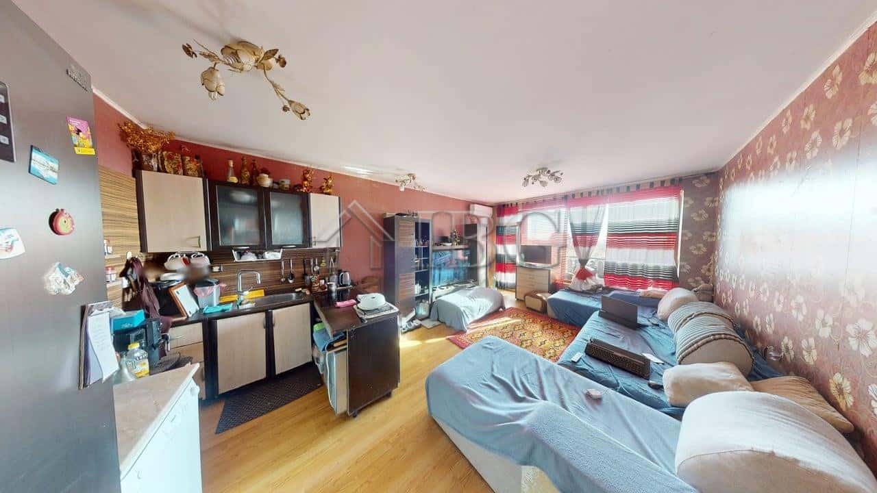 Spacious two-bedroom apartment in Sunny House Complex, Kosharitsa, with modern furnishings and brigh.
