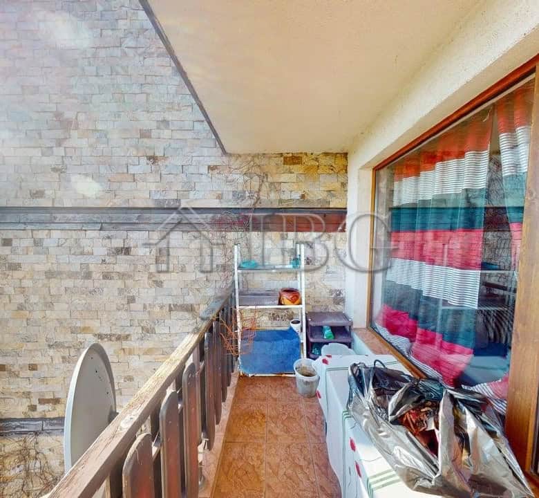Balcony of a two-bedroom apartment in Sunny House Complex, Kosharitsa, showcasing outdoor space and.