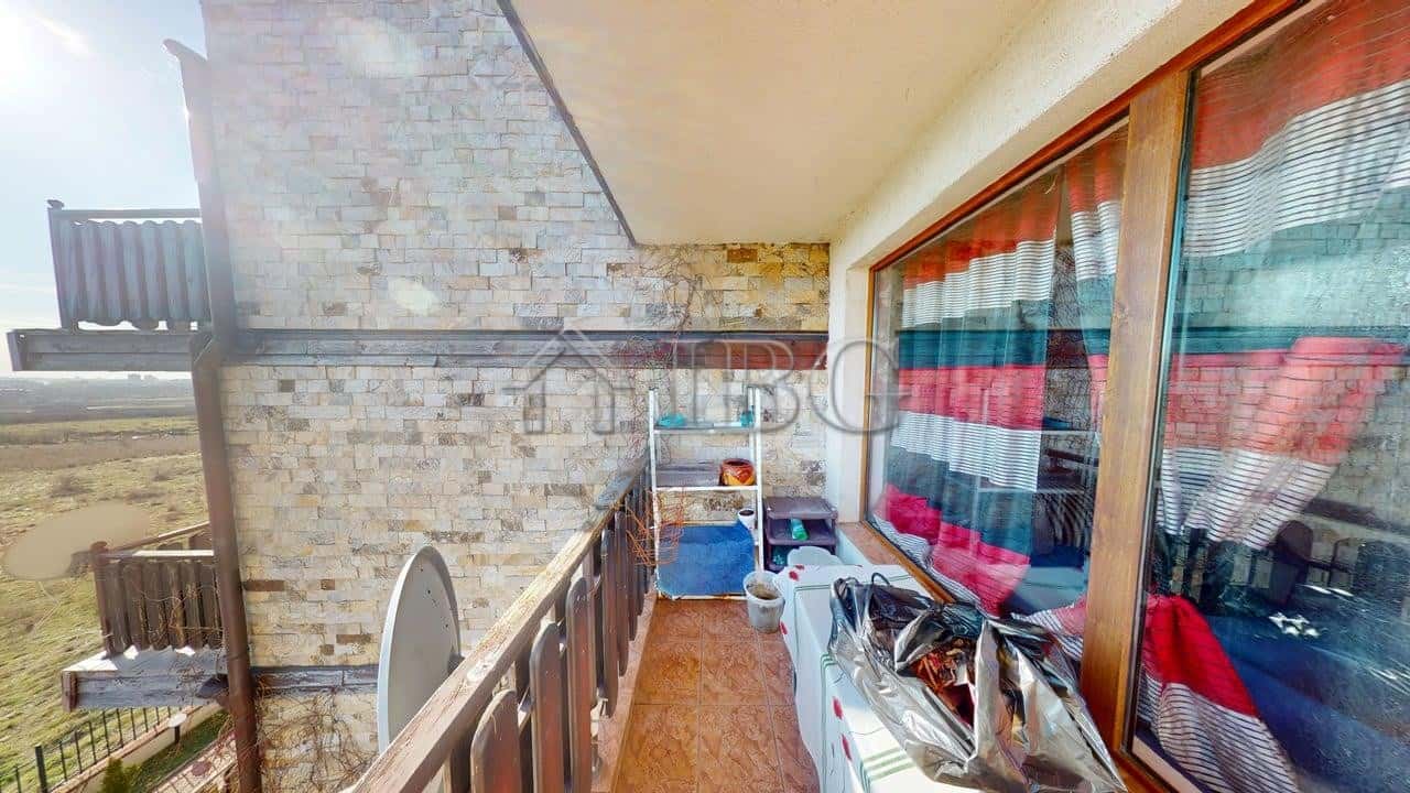 Balcony of a two-bedroom apartment in Sunny House Complex, Kosharitsa, showcasing outdoor space and.
