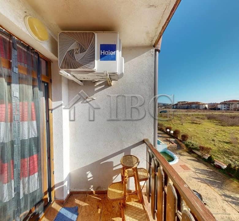 Balcony of a two-bedroom apartment overlooking green fields in Kosharitsa.