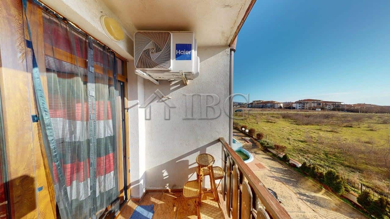 Balcony of a two-bedroom apartment overlooking green fields in Kosharitsa.