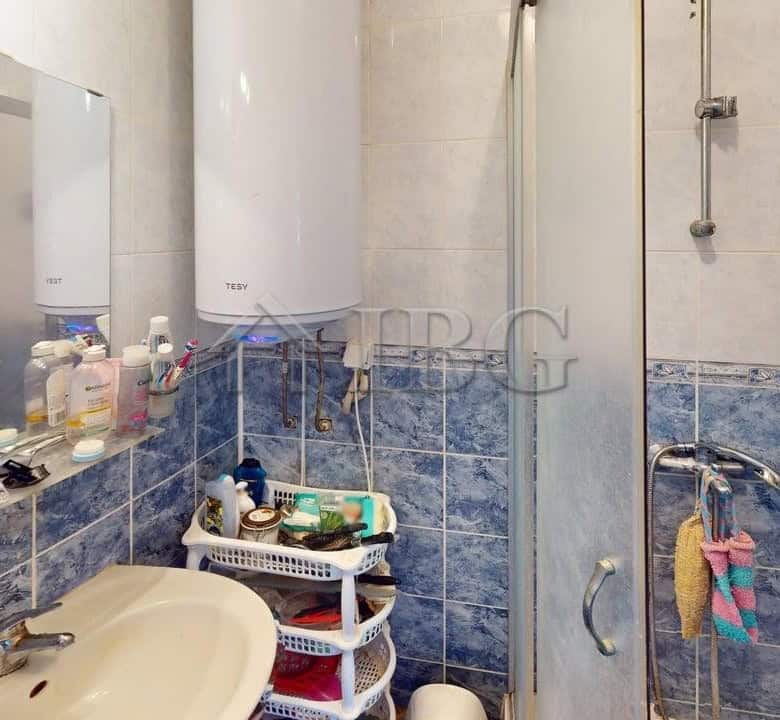 Bathroom with shower, sink, and storage in Sunny House Complex, Kosharitsa.