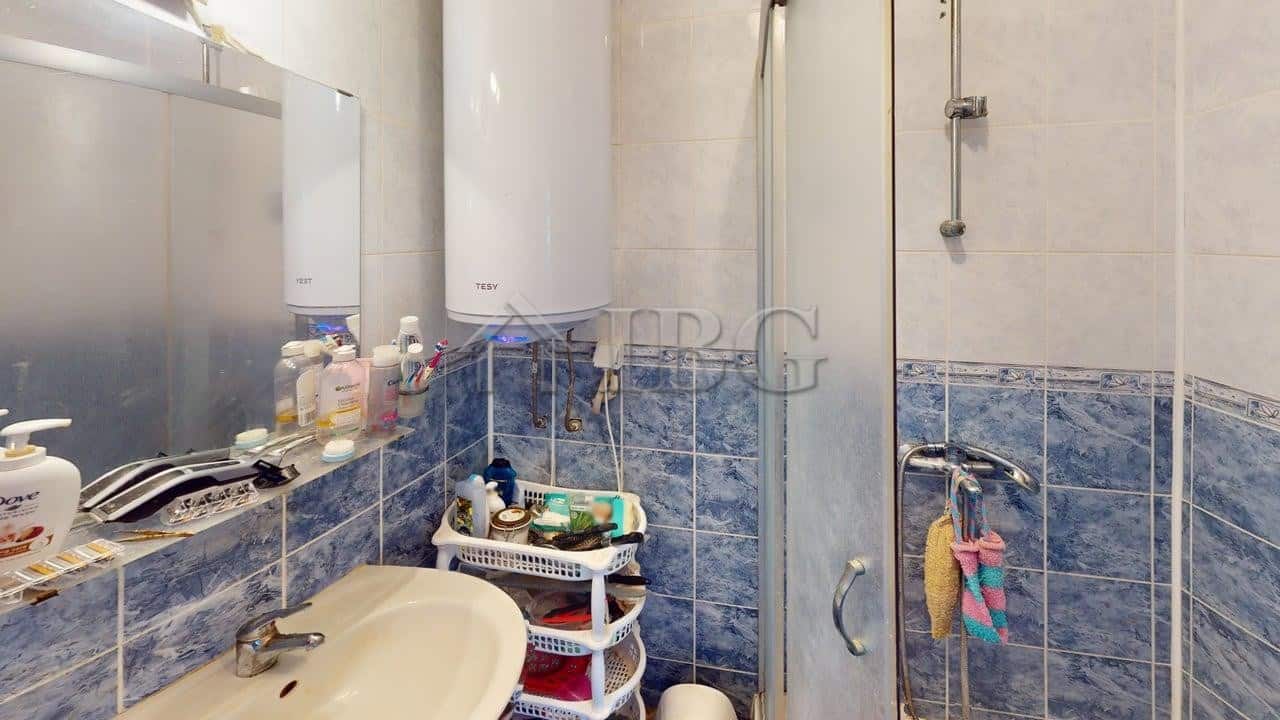 Bathroom with shower, sink, and storage in Sunny House Complex, Kosharitsa.