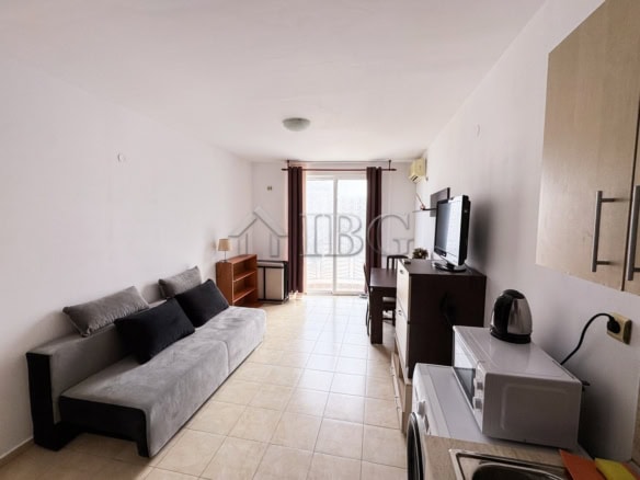 Compact studio apartment with pool view and sunny balcony.