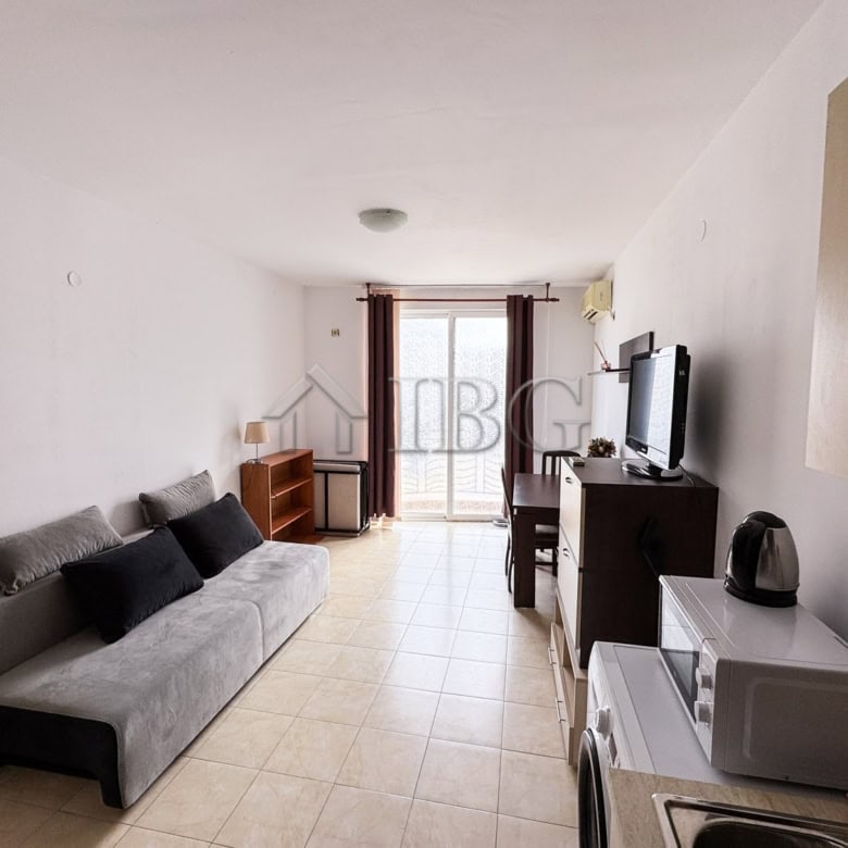 Compact studio apartment with pool view and sunny balcony.