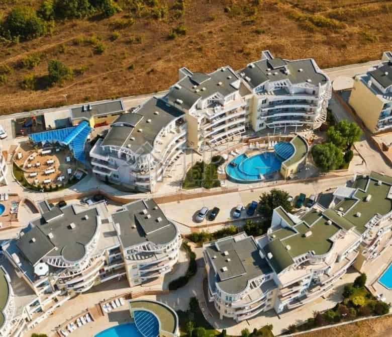 Aerial view of Sunset Kosharitsa showing one-bedroom apartments with garden access and swimming pool.