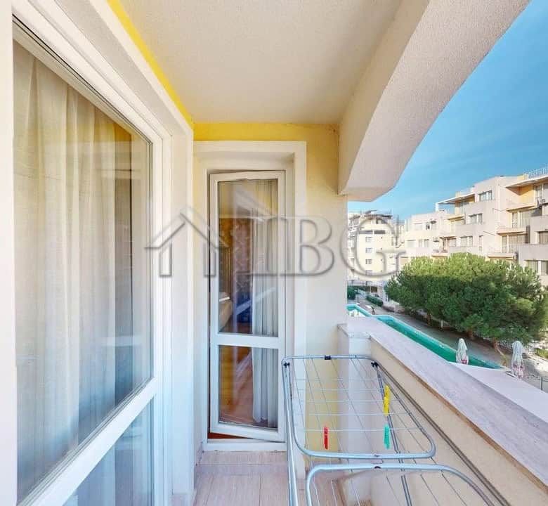 Bright balcony of a 2-room apartment in Sunny Beach with sea view and modern furnishings.