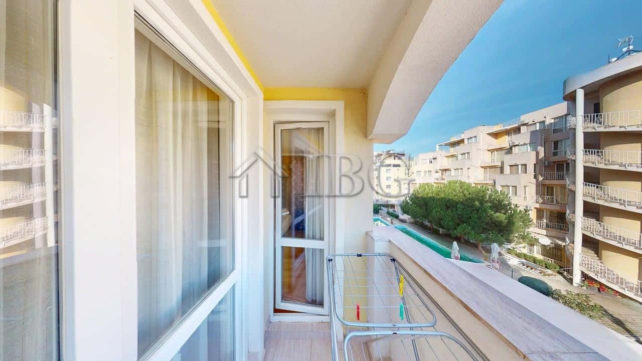Bright balcony of a 2-room apartment in Sunny Beach with sea view and modern furnishings.